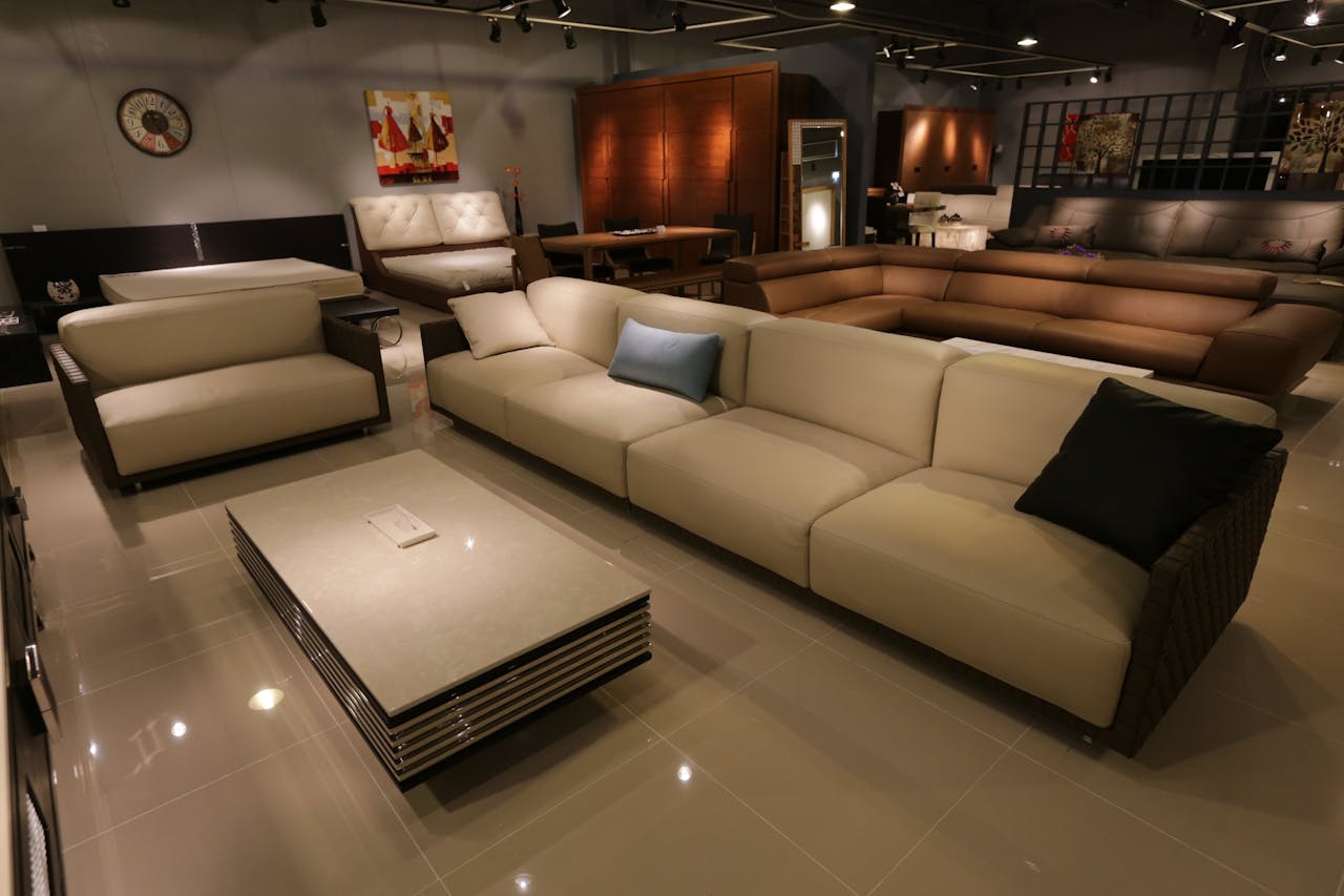 gallery-05 Elegant living room showcasing modern furniture with plush sofas and ambient lighting.